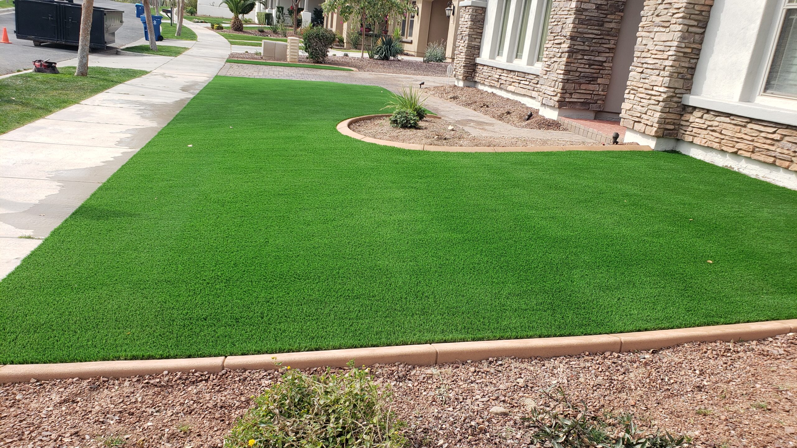 artifial grass with curbing in front yard