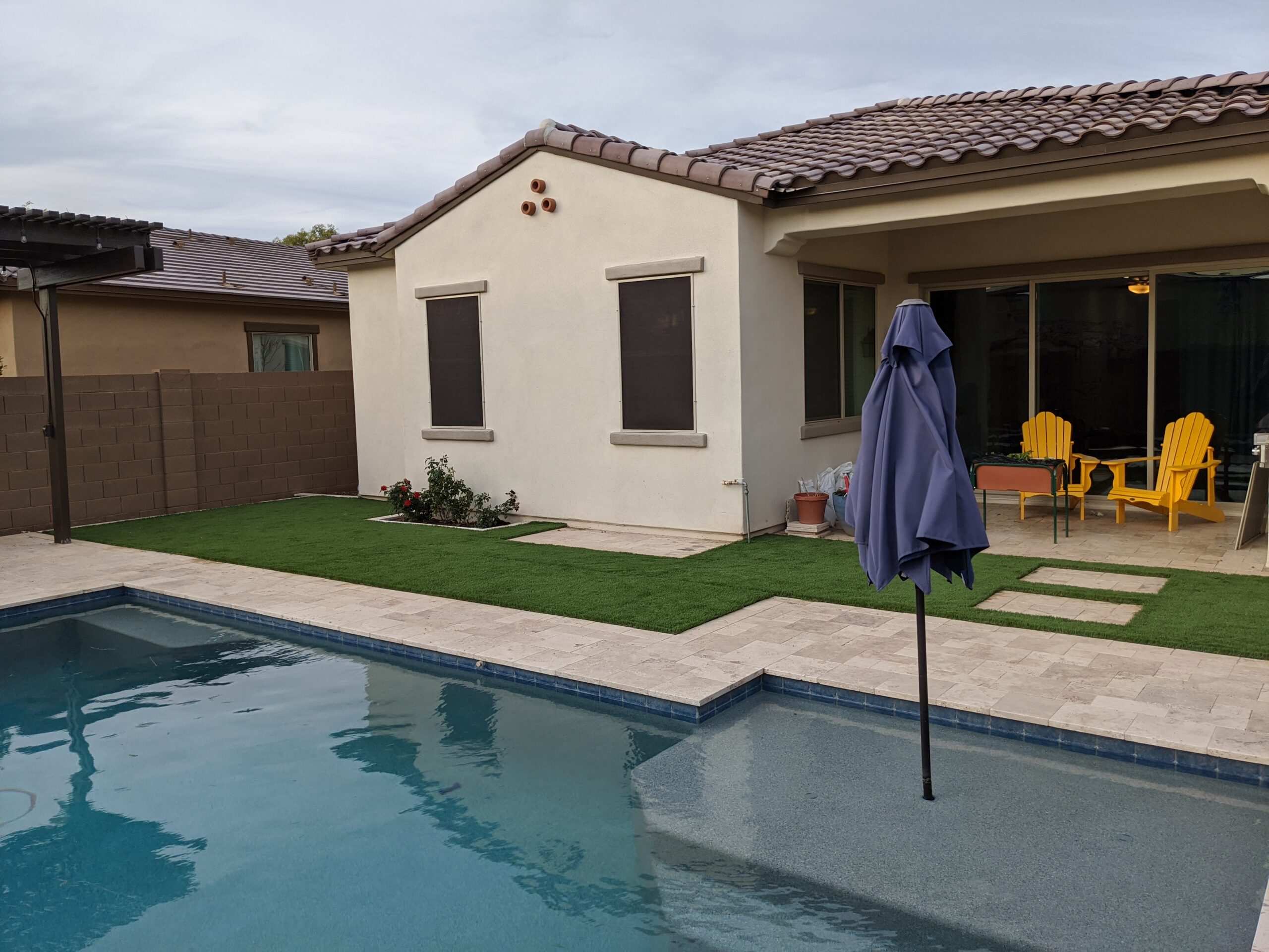 artificial grass backyard with pool