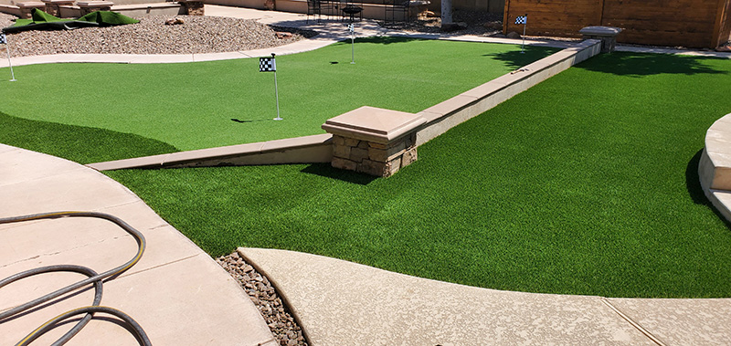 Multi-level putting green course with concrete cubing