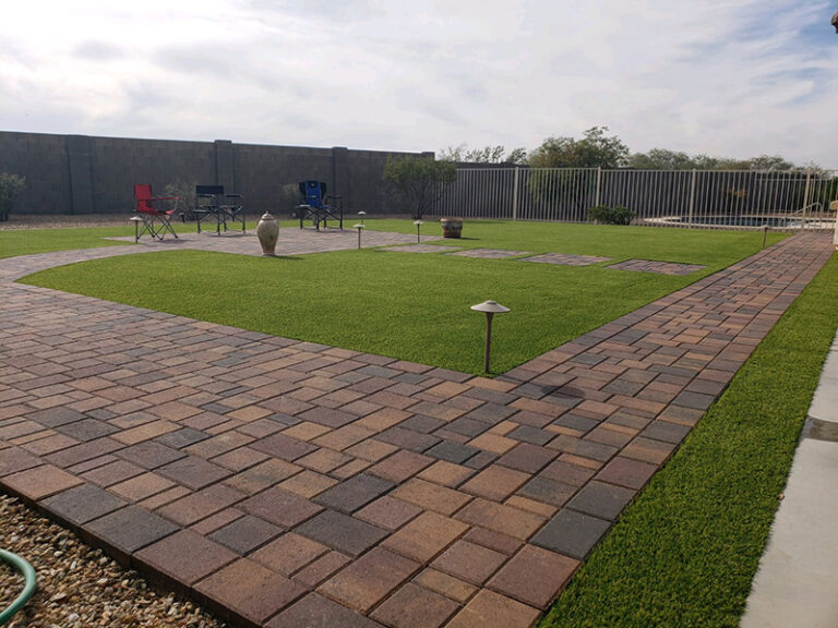 Large Area Of Square top Pavers with fake grass