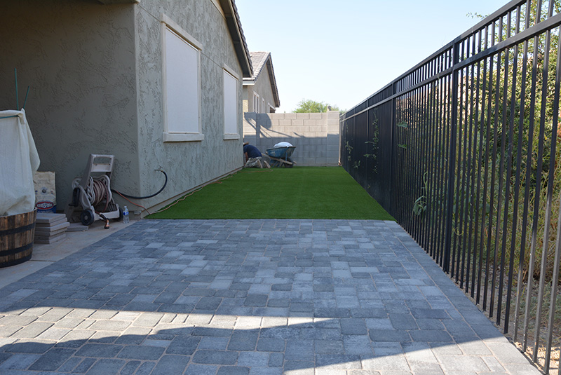 backayrd pavers with artificial grass