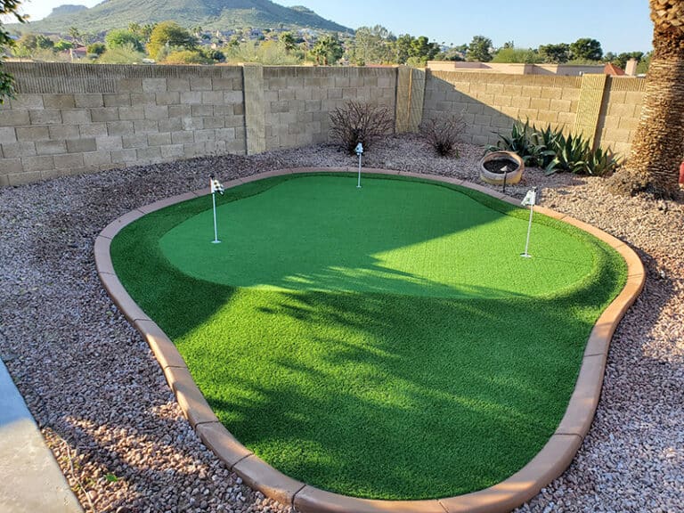 Backyard custom putting green with curbing and large fringe area