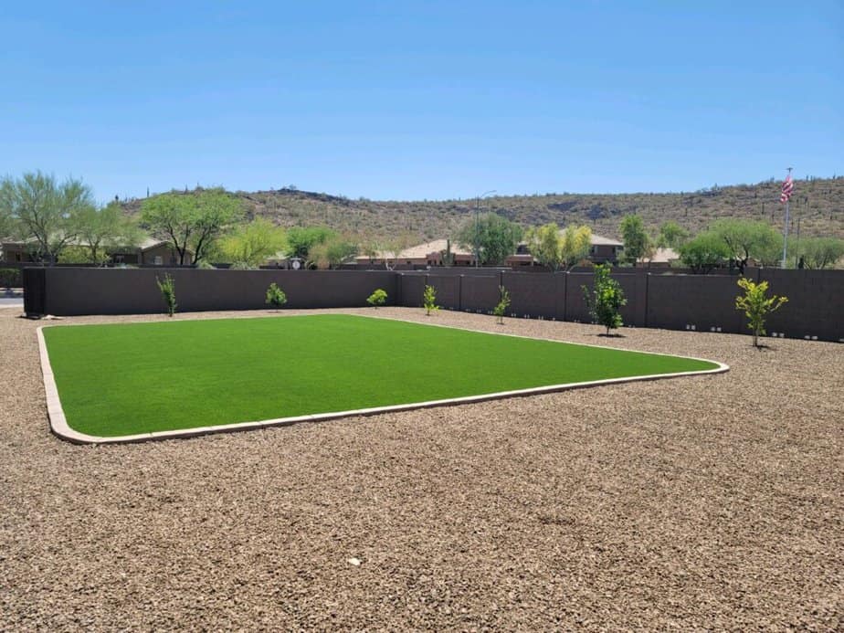 large artificial grass area in backyard