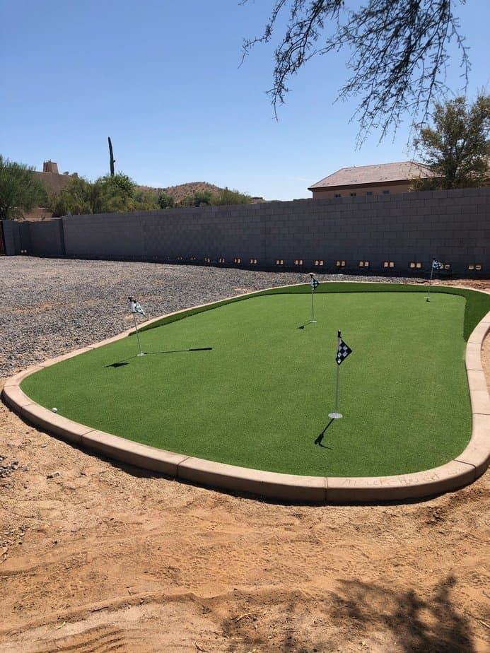 Putting green installed with concrete curbing