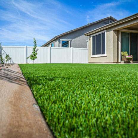 Synthetic grass with concrete curbing landscape