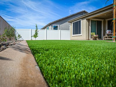 Synthetic grass with concrete curbing landscape